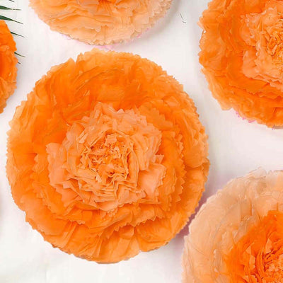 Orange tissue paper flowers arranged in a circular pattern