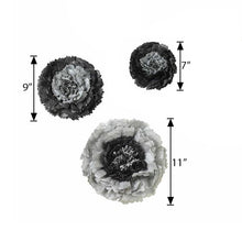 Three charcoal gray paper flowers with measurements on a white background