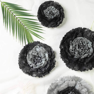Black and gray decorative flowers with palm leaves on a white background