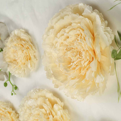 Cream paper flowers arranged decoratively on a light background.