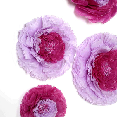 Purple and pink paper flowers on a white background.