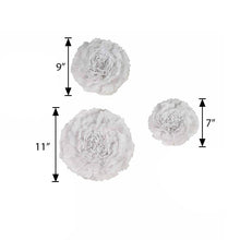 A set of three giant white paper flowers with measurements on a white background