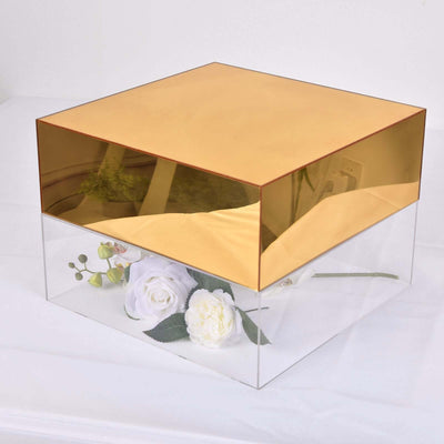 Gold and clear acrylic box with flowers inside, studio shot.