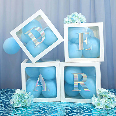 Decorative balloon-filled boxes with letters spelling "DEAR" in pastel colors.