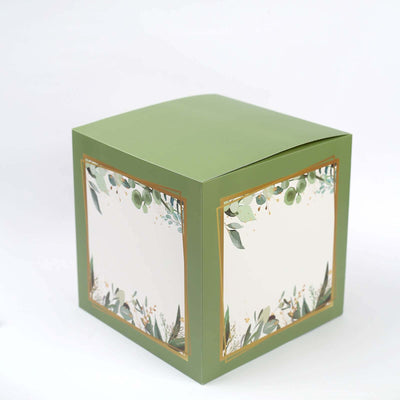 Green gift box with floral design and gold accents on a white background