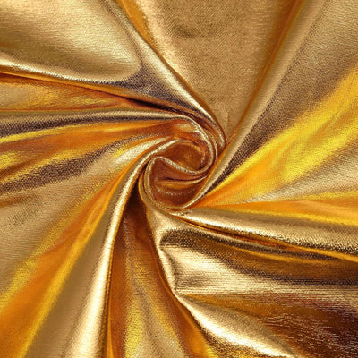 Shiny golden fabric texture with a swirling pattern.