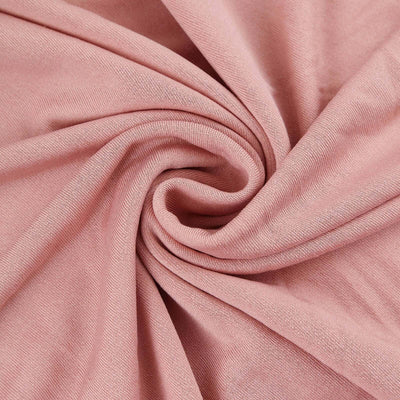 Pink fabric texture with soft draping and gentle folds.
