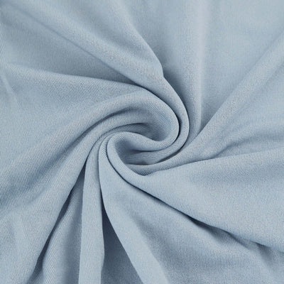 Light blue fabric texture in a swirl pattern.