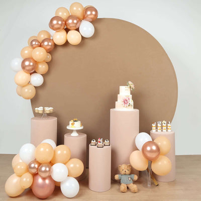 Festive dessert display with balloons and a cake for celebrations.