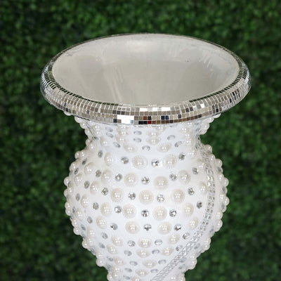Elegant white vase adorned with silver accents and decorative details.
