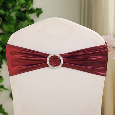 Burgundy chair sash with rhinestone buckle for elegant event decor.