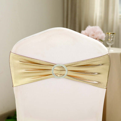 Gold chair sash with rhinestone embellishment on a fabric-covered chair.