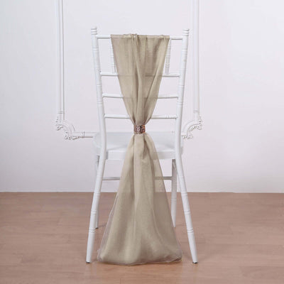 Elegant beige chair sash draped on a white chiavari chair.