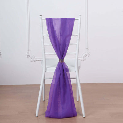 Purple chair sash draped elegantly on a white chair.