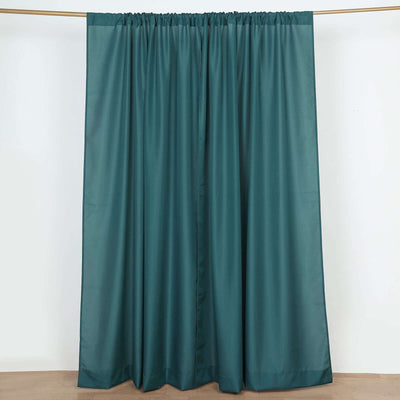 Teal curtain panel on a plain background