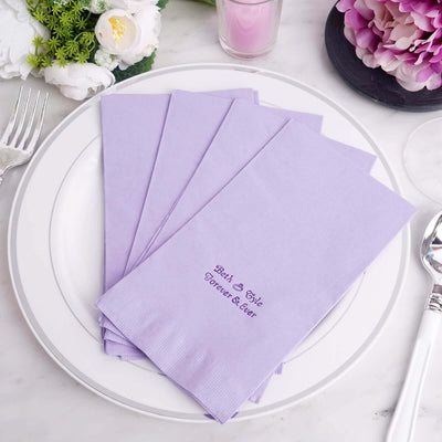 Purple napkins with "Best Day Ever" printed, arranged on a white plate.