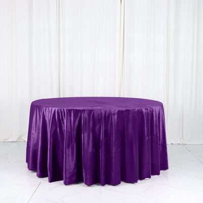 Purple round tablecloth with elegant draping