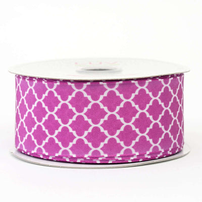 Purple patterned ribbon on a spool for crafting and decorations