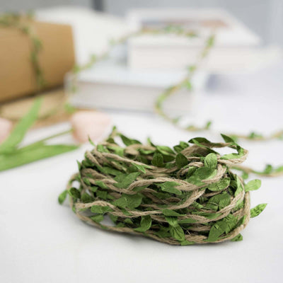 Green leaf garland wrapped in twine on a white background