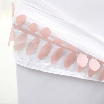 White fabric detail with pink leaf embellishments.
