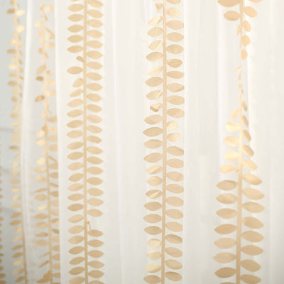 White sheer curtain with gold leaf pattern design.