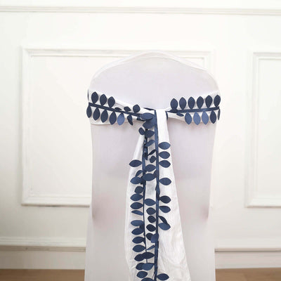 Navy leaf-pattern chair sash on a white chair