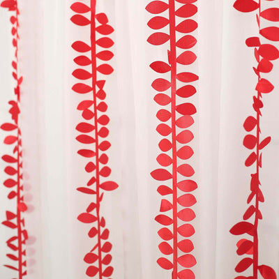 Red leaf patterned sheer curtain against a light background.