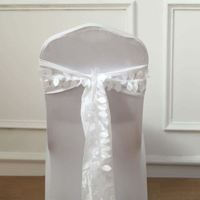 White chair cover with decorative ribbon tie.