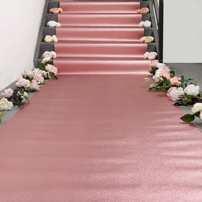 Pink glitter runner with floral accents on a staircase.