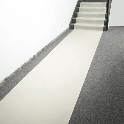 Stair runner carpet on a staircase and floor in a modern interior setting.