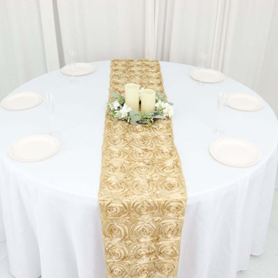 Gold rose table runner on a round table set with plates and candles.
