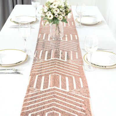 Rose gold patterned table runner on a dining table setting.