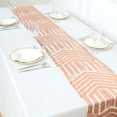 Decorative table runner with geometric pattern on a white tablecloth.