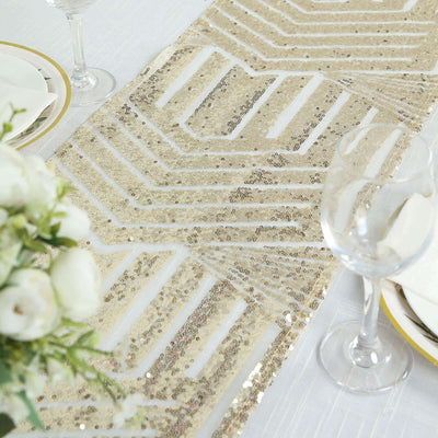 Gold sequin table runner with geometric pattern on a white table setting.