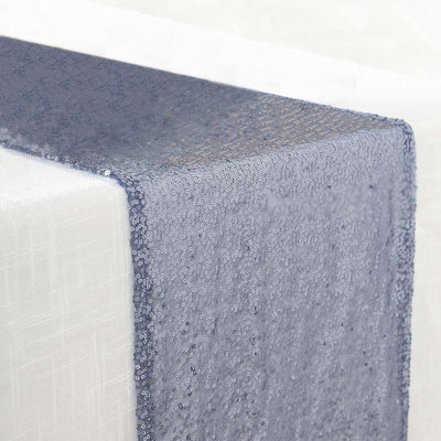 Blue sequin table runner draped elegantly on a white table