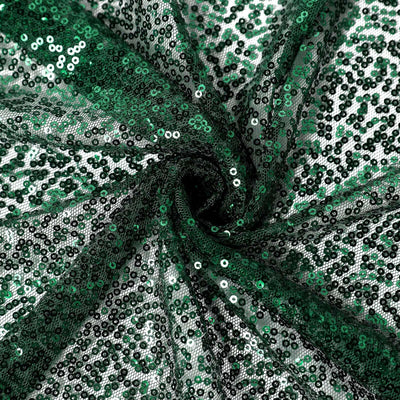 Green sequin fabric with shimmering texture and intricate detailing.