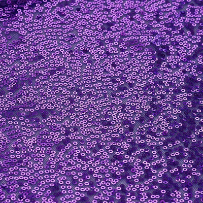 Purple sequin fabric with intricate patterns and shimmering details.