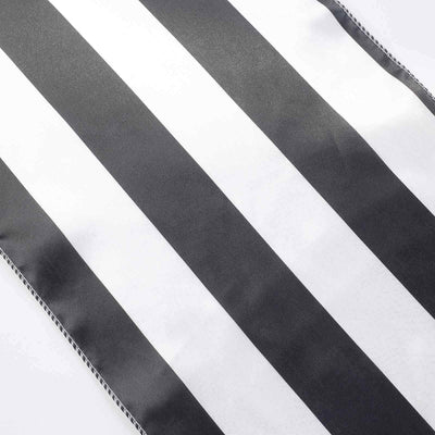Black and white striped ribbon on a plain background