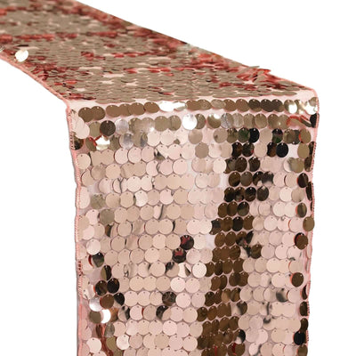 Rose gold sequin table runner on a plain background