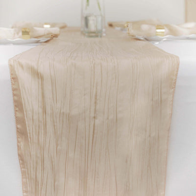 Beige table runner with textured pattern on a dining table.