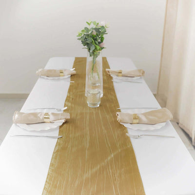 Elegant gold table runner on a dining table set for a meal.
