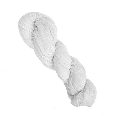 White twisted fabric roll on a plain background