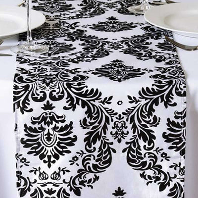 Black and white damask table runner on a dining table
