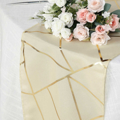 Gold geometric table runner with floral arrangement