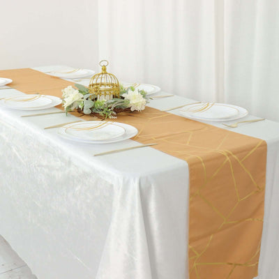 Elegant gold and white table runner on a beautifully set dining table.