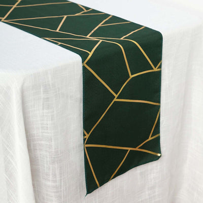 Green and gold geometric table runner on a white tablecloth.