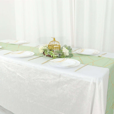 Elegant table setting with gold accents and decorative birdcage centerpiece.