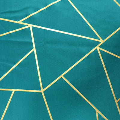 Teal fabric with geometric gold pattern design.