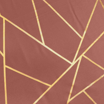 Geometric patterned fabric in rust and gold tones.