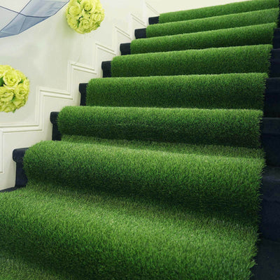 Artificial grass carpet on staircase with decorative flowers.
